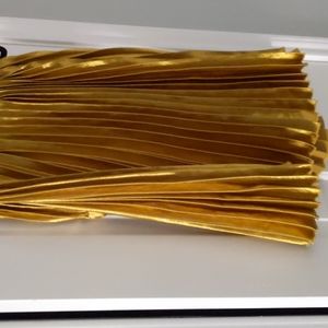 M gold pleated skirt